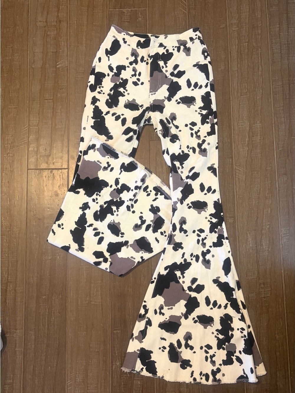 Altar'd State Black & White Cow Print Flare Jeans